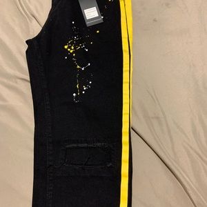 Black jean with yellow stripes